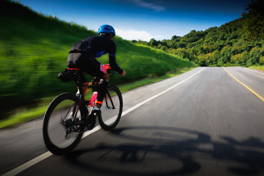 Motion blur of Cyclist in maximum effort in a road outdoors