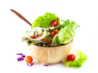 vegetables salad in a wooden bowl isolated on white