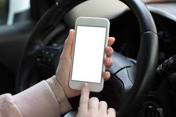 Female hands holding phone with isolated screen behind wheel car