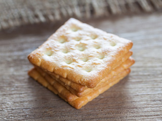 Crackers or biscuit on wooden background