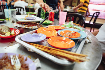 Empty color plates when you finished satay. Satay is a dish of skewered grilled meat with Javanese origins in Malacca City, Malacca, Malaysia.