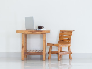 Working table with laptop and coffee cup, interior design
