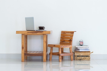 Working table with laptop and coffee cup, interior design