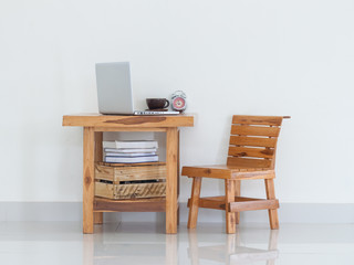 Working table with laptop and coffee cup, interior design