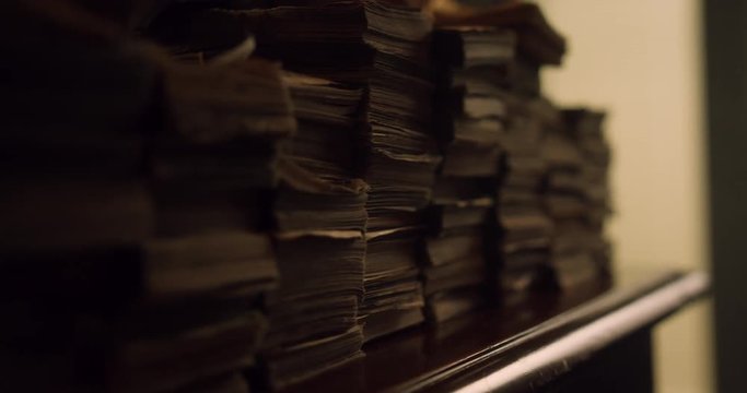Bundles of cash on the table. Dolly shot of pile of American banknotes, bundle of money. US Dollar is official currency of United States