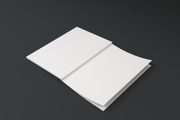 Mockup of blank white open brochure lying with cover upside on black background