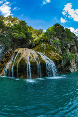 The picturesque azure waterfall on the side wall © Kushnirov Avraham