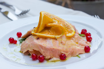 Salmon marinated into orange