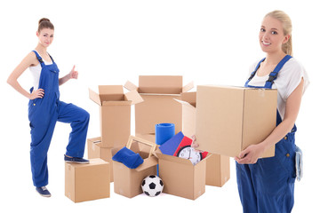 moving day concept - women in blue workwear with cardboard boxes isolated on white