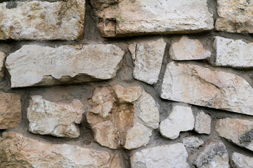 old wall of rough stones as background