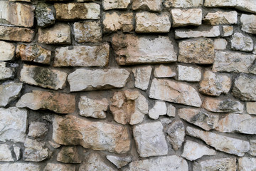 old wall of rough stones as background
