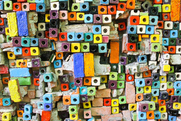 Obraz na płótnie Canvas The walls are made of brick blocks of multiplicity colors.
