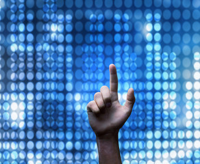 Hand pushing on a touch screen.