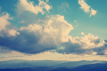 Beautiful clouds at sunset in the mountains.Vintage filter instagram.