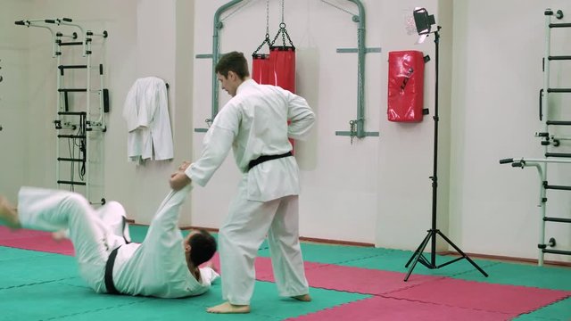 kTwo karate players compete in the ring 4k