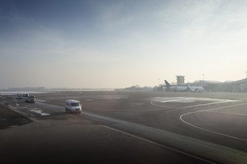 Airport with many airplanes at beautiful sunset