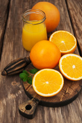 Obraz na płótnie Canvas Jar of juice and fresh oranges