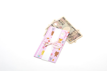 Obraz na płótnie Canvas 白背景の無地のお祝いの袋と一万円札　Celebration bag with white background and 10,000 yen bill