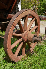 A wooden wheel with an iron rim of an old peasant cart