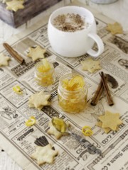 cup of aromatic cappuccino with cookies, orange marmalade. selective focus