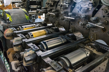 Golden Letterpress Cylinders Rustic Vintage Printing Method Metallic Rollers Four Color CMYK Print Closeup Machine Industrial Equipment