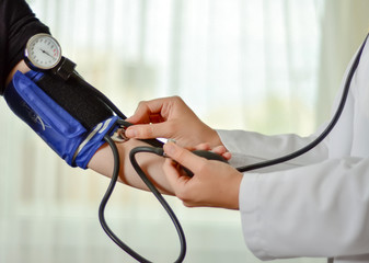 Doctor analyzing blood pressure   