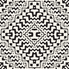 Black and white tribal vector seamless pattern with doodle elements. Aztec abstract art print. Ethnic ornamental hand drawn backdrop.