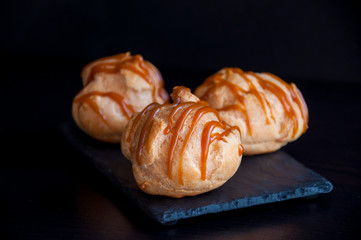 Profiteroles with caramel sauce