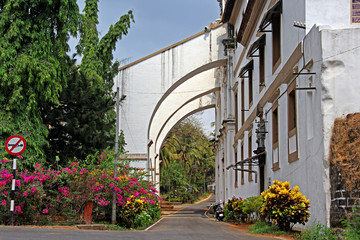 Fototapeta na wymiar Entrance of Museum of Christian Art in Old Goa, India. The museum, set up in 1994 in the Convent of Santa Monica, exhibits Indo Portuguese religious art, paintings and sculptures.
