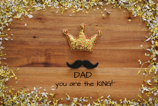 Top view image of funny mustache and glitter crown. Father's day concept