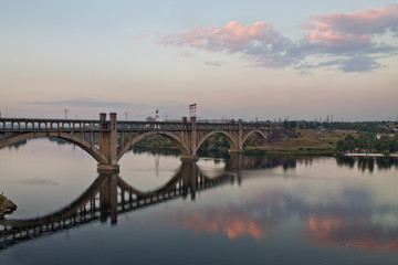 Fototapeta na wymiar Evening Zaporozhye, Ukraine. Bridge across the Dnieper
