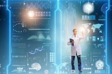 Doctor in futuristic medical concept pressing button