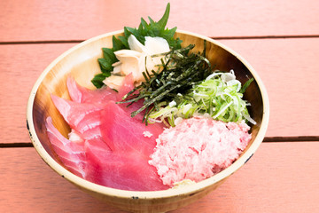 bowl of rice topped with sashimi