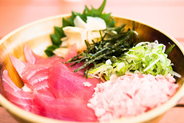 bowl of rice topped with sashimi