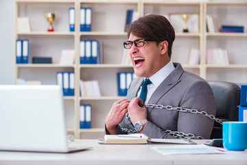 Naklejka premium Businessman tied with chains to his work
