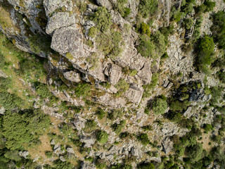 Aerial view of rocks and shrubs in Corsica