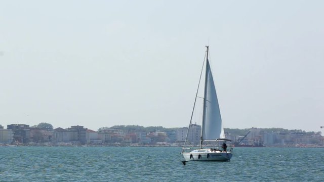 Sailing Ship yachts with white sails in the open Sea in Italy