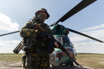Photo of a soldier with an automatic rifle