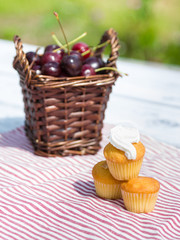 Fototapeta na wymiar Sweet muffins with cherry outdoor