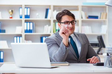 Fototapeta premium Businessman with paper airplane in office