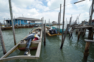 Fototapeta premium Fisherman boats anchored at Tanjung Piai jetty. Tanjung Piai is a cape in Johor, Malaysia. It is the most southern point of mainland Asia.