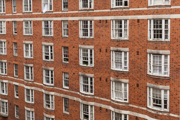 Fototapeta na wymiar brick building facade - tenement building exterior, England