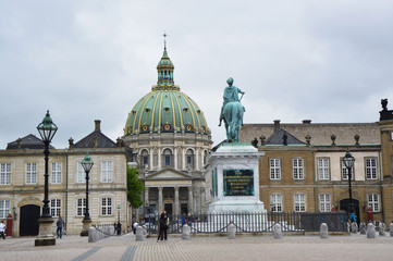 COPENHAGEN, DENMARK - MAY 31, 2017: Amalienborg Slotsplads square with a monumental equestrian statue of Amalienborg's founder, King Frederick V and Frederik's Church on the background, Copenhagen 