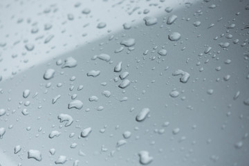 rain drops on car with glass coating protection skin