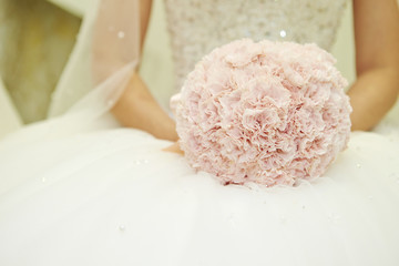 Bride holding flower bouquet 