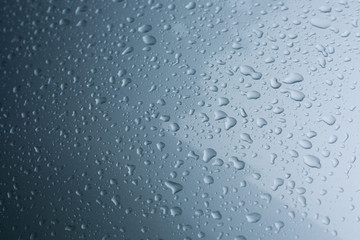 rain drops on car with glass coating protection skin