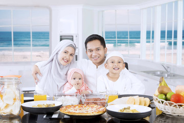 Muslim parents and children smiling