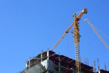 machinery crane working in construction site building