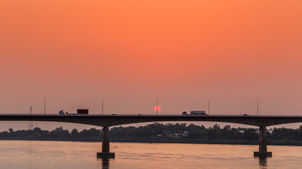 Fototapeta na wymiar Bridge across the Mekong River at sunset. Thai-Lao friendship bridge at Nong Khai Thailand