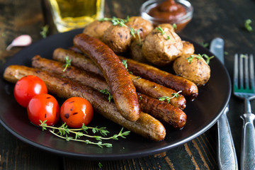Fried sausages with baked potatoes